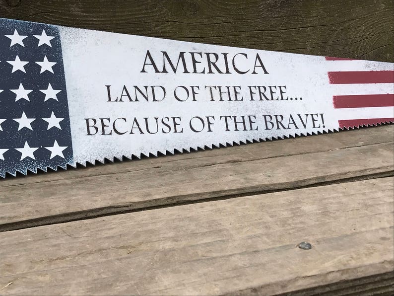 land of the free because of the brave sign