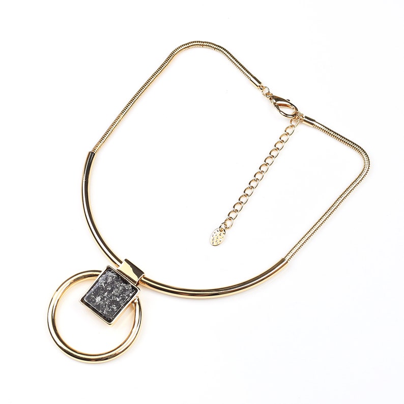United Elegance Bold Gold Tone Necklace With Eye Catching Stone Pendant