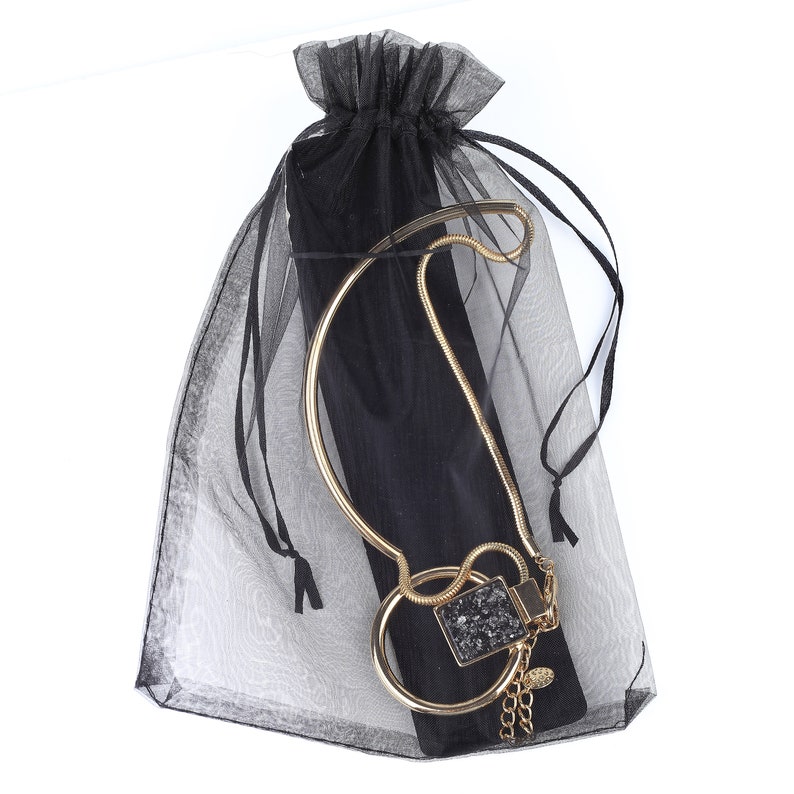 United Elegance Bold Gold Tone Necklace With Eye Catching Stone Pendant